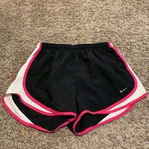 Black and pink Nike running shorts